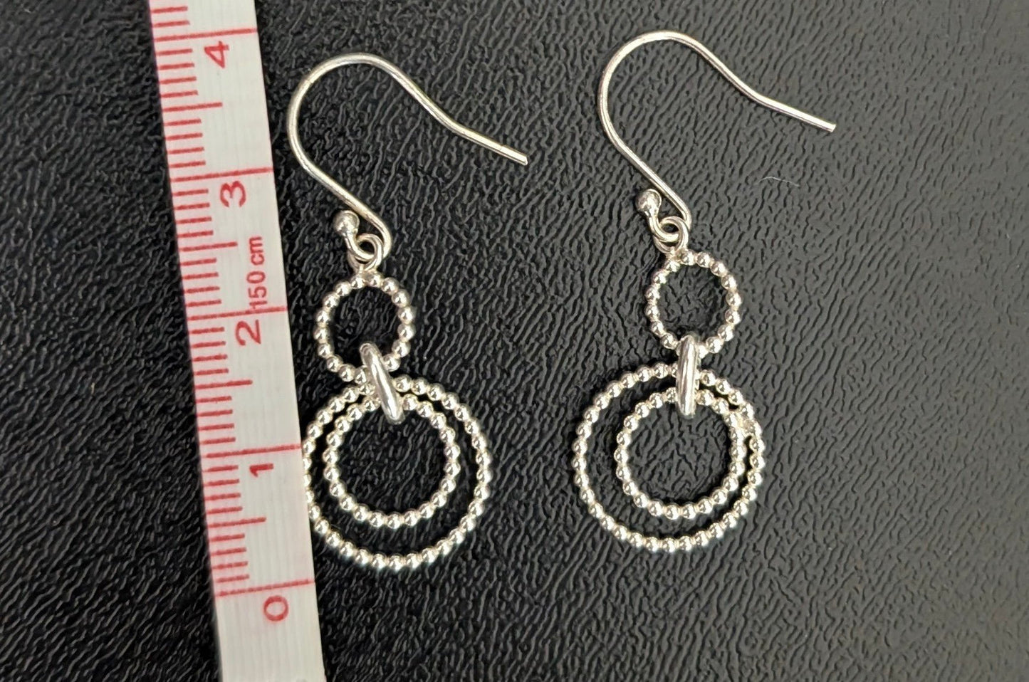 Silver Dangling Circular Rope Earrings Sparkle