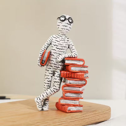 The Newsprint Reader Figurine