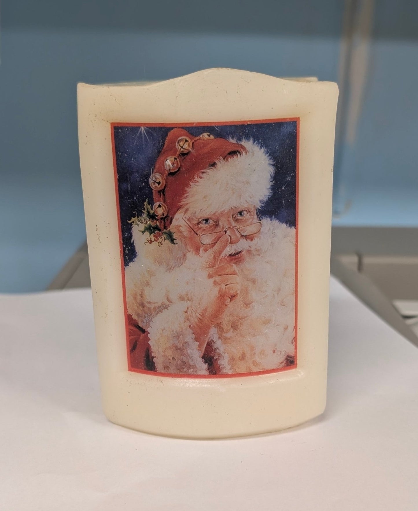 Dona Gelsinger Santa Christmas Candle - The Bookstore