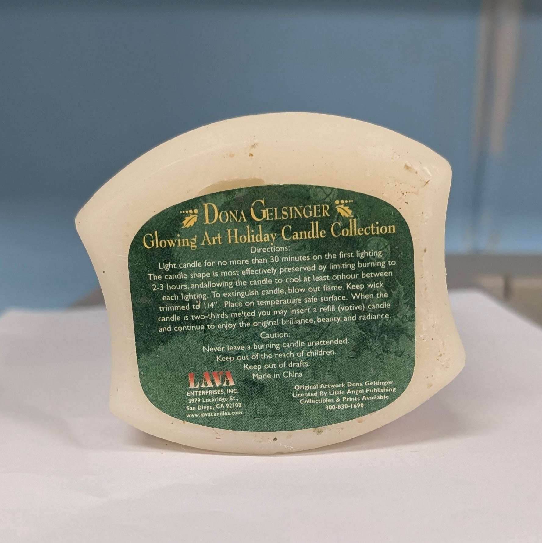 Dona Gelsinger Santa Christmas Candle - The Bookstore