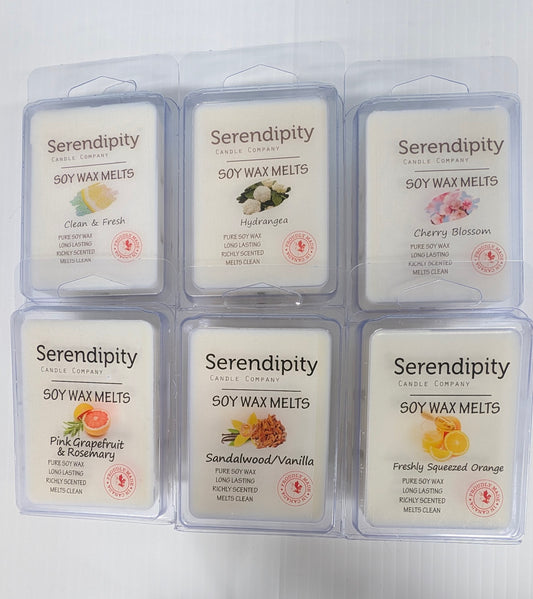 Six packages of Serendipity Soy Wax Melts on a white background