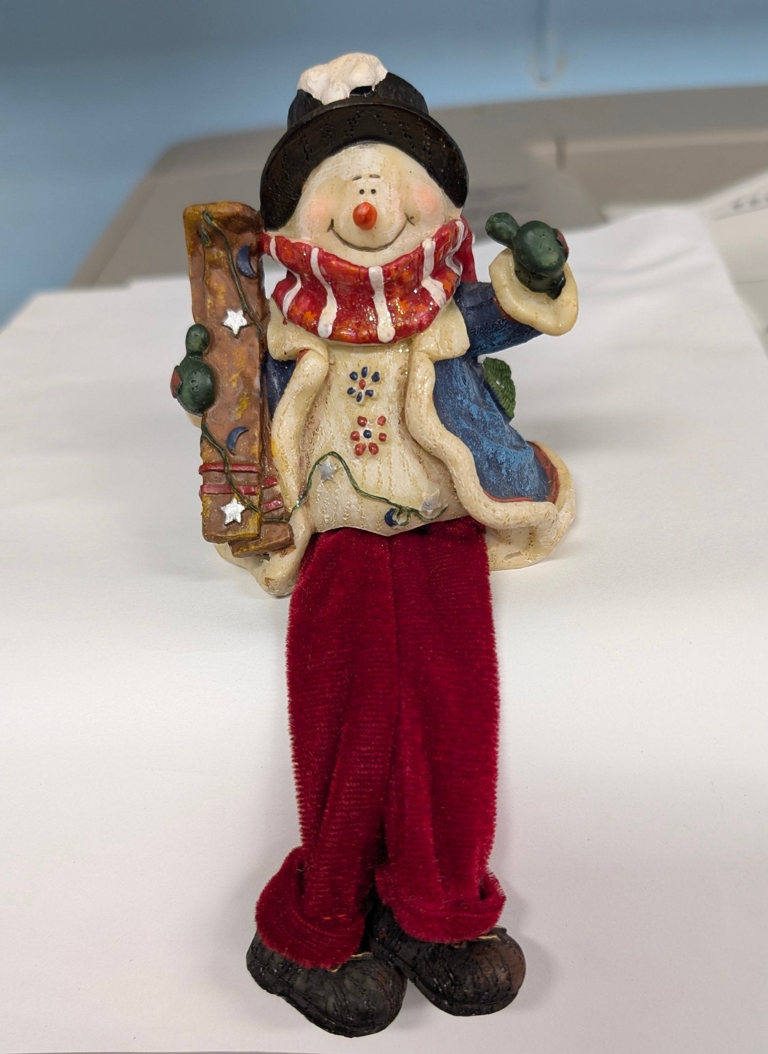 Snowman with Skis Shelf Sitter - Festive Resin Figurine with Red Velvet Legs - The Bookstore