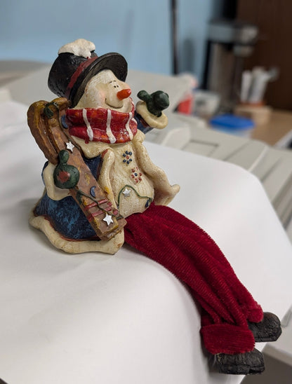 Snowman with Skis Shelf Sitter - Festive Resin Figurine with Red Velvet Legs - The Bookstore