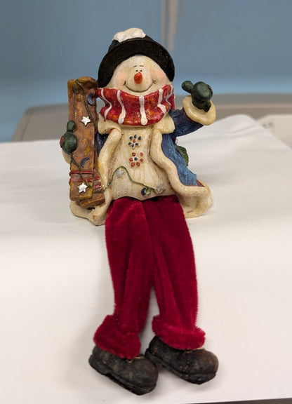 Snowman with Skis Shelf Sitter - Festive Resin Figurine with Red Velvet Legs - The Bookstore